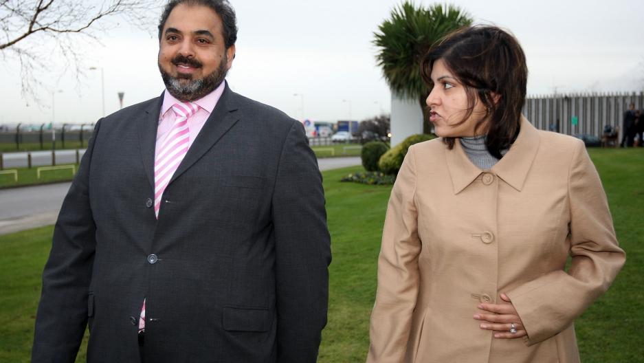 Lord Ahmed talks with Baroness Warsi on arrival from Sudan at London Heathrow Airport in December, 2007